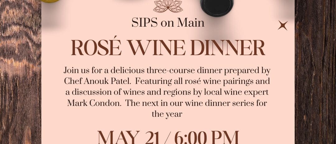 A promotional flyer for the Rosé Wine Dinner at Sips on Main. Visual Composition: Top Section: Four wine bottles with different colored caps (gold, pink, black, and magenta) are lying horizontally against a dark wood-grain background. Main Body: A light pink rectangular paper overlay features the event title "ROSÉ WINE DINNER" in large, elegant brown serif font. Details: The text lists Chef Anouk Patel and wine expert Mark Condon as the evening's hosts, noting a three-course dinner with rosé pairings on May 21 at 6:00 PM. Accents: Small brown starburst icons and a lotus flower logo decorate the corners and center of the invitation.